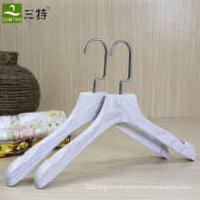 white color women boutique wooden clothes hanger